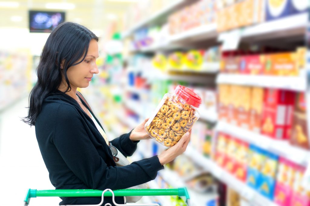 Woman reading a nutrition label
