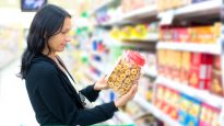 Woman reading a nutrition label