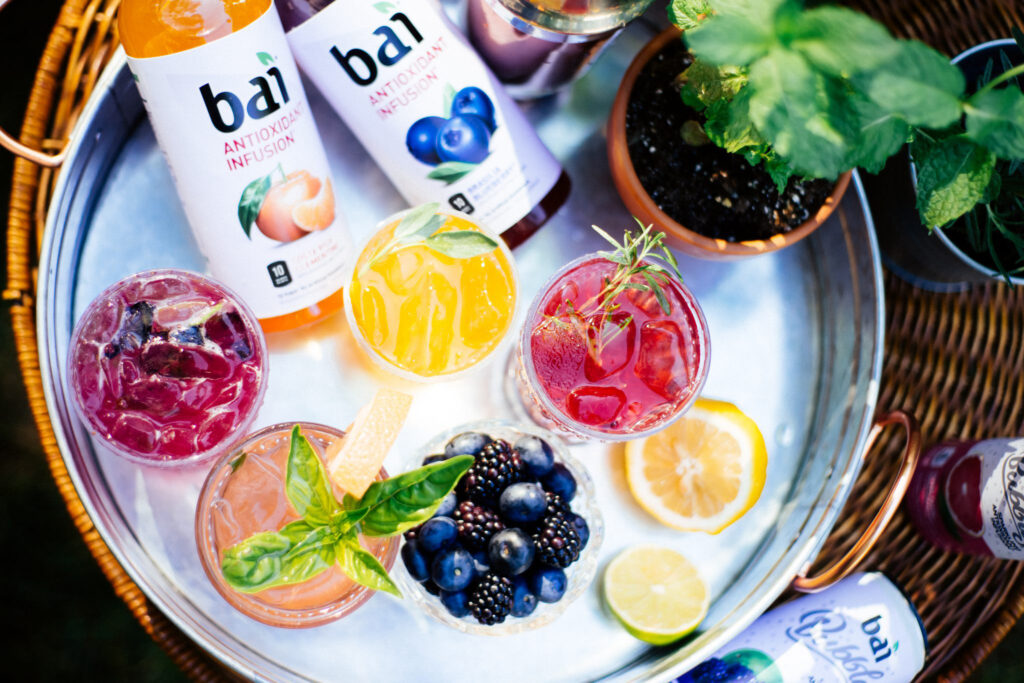 Bai drinks with blueberries and mint plant