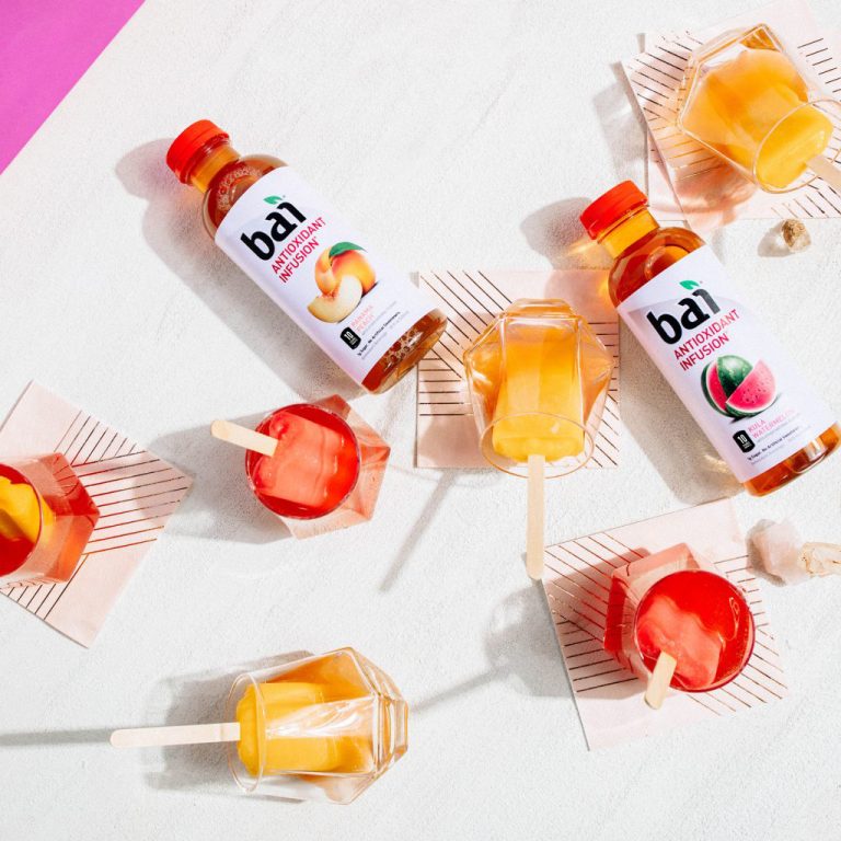 Bai Panama Peach and Bai Kula Watermelon with frozen popsicles on napkins