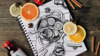 Drawing on notebook paper of oranges and lemons in a pot with Bai Ipanema Pomegranate, cinnamon sticks, and cloves