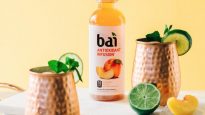 Bai Panama Peach Frozen Peach Mule Cocktail with limes