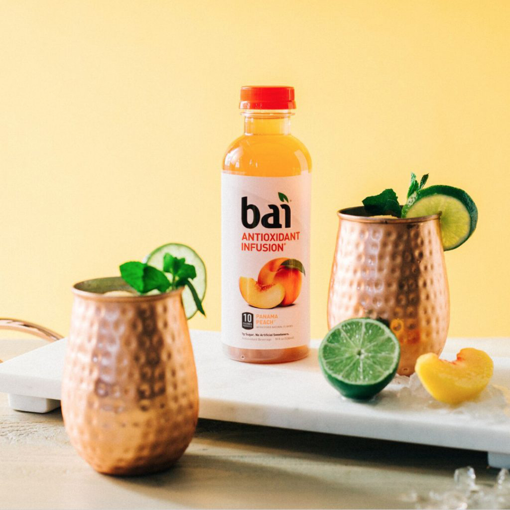 Bai Panama Peach Frozen Peach Mule Cocktail with limes