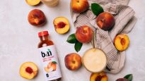 Peaches and a peach smoothie made with Bai Panama Peach