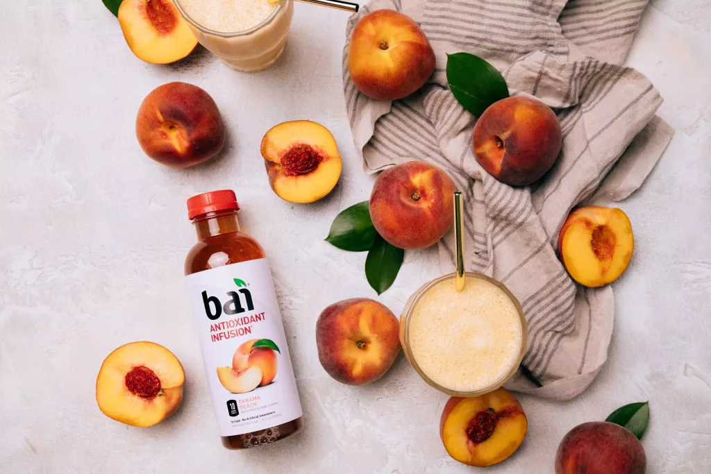 Peaches and a peach smoothie made with Bai Panama Peach