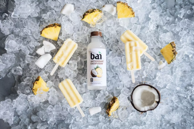 Pina Colada Popsicles around ice, coconut, and pineapple with Bai Molokai Coconut