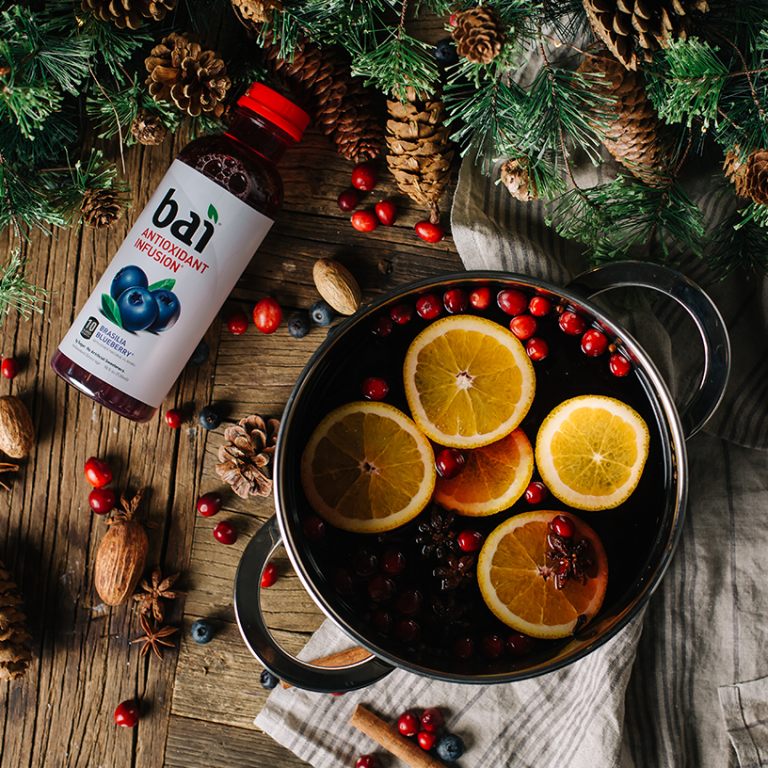 Pine cones and needles with a pot of wine and oranges made with Bai Brasilia Blueberry