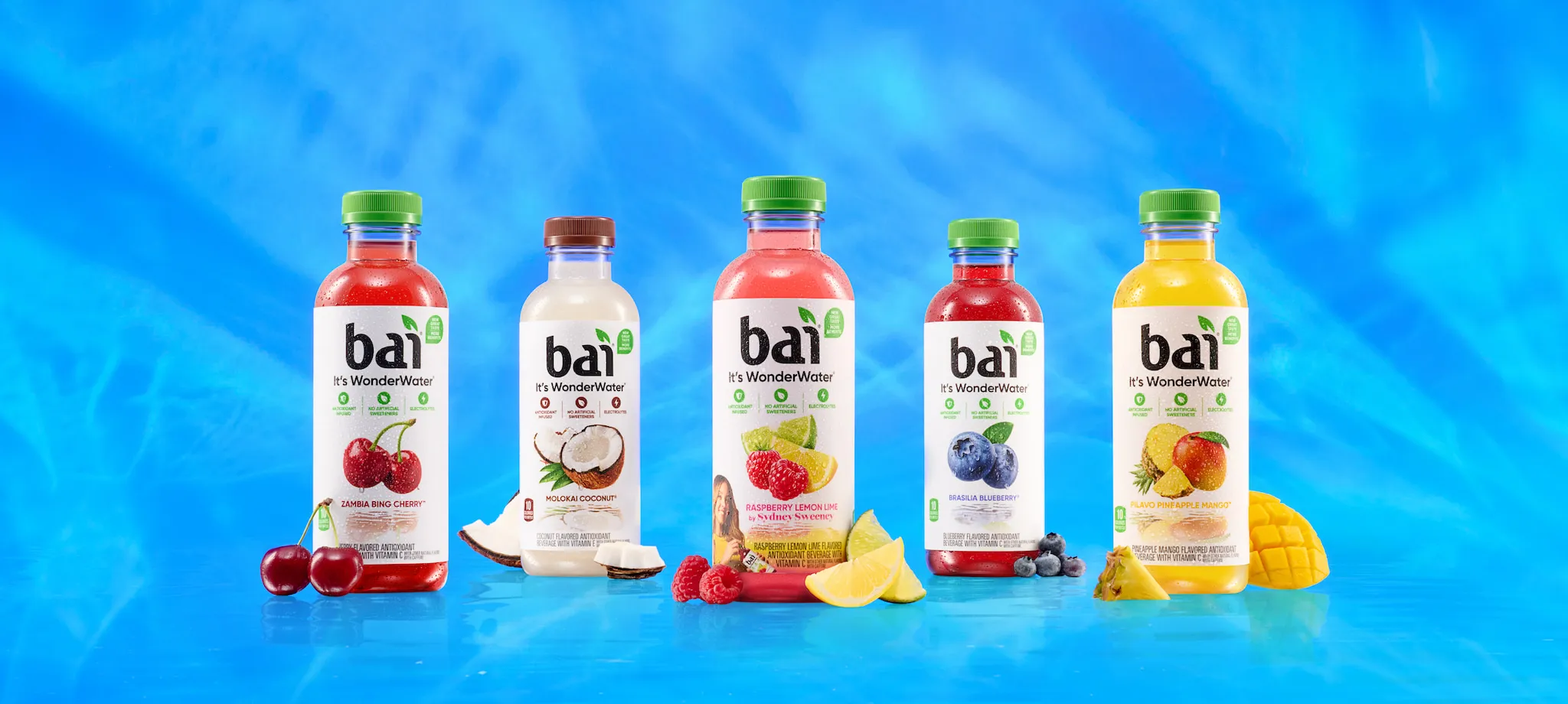 Bai Bottles and 6 packs next to fruit based on their respective flavors