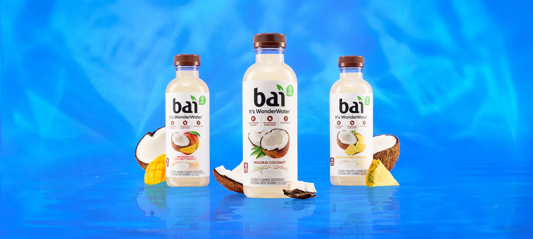 Bai Cocofusion Bottles next to fruit based on their respective flavors